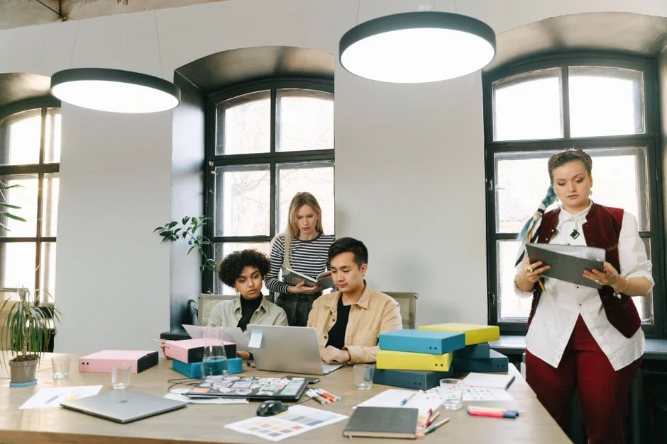 Bright highlighters on a User-Generated Content note against a wooden desk.